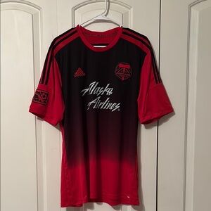 Gently used Adidas Men’s Red and Black Portland Timbers Soccer Jersey.